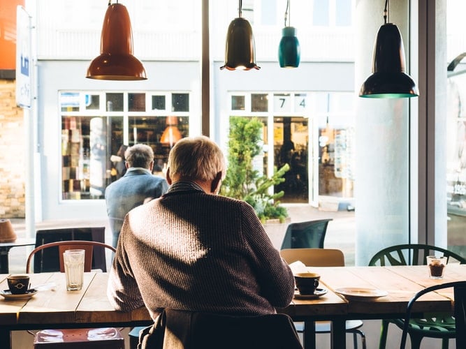 Man sitting inside coffee shop.