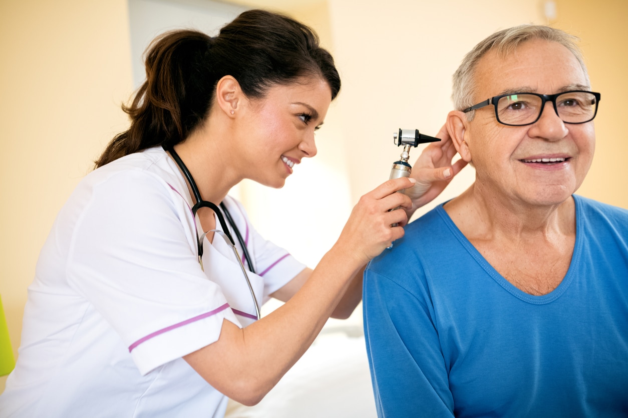 Senior man in an ear exam